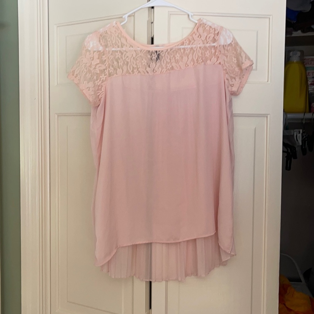 Pink top with detailed ruffle back. Lace at top.